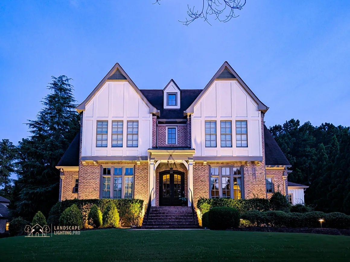 A home illuminated at dusk by the premium starter package